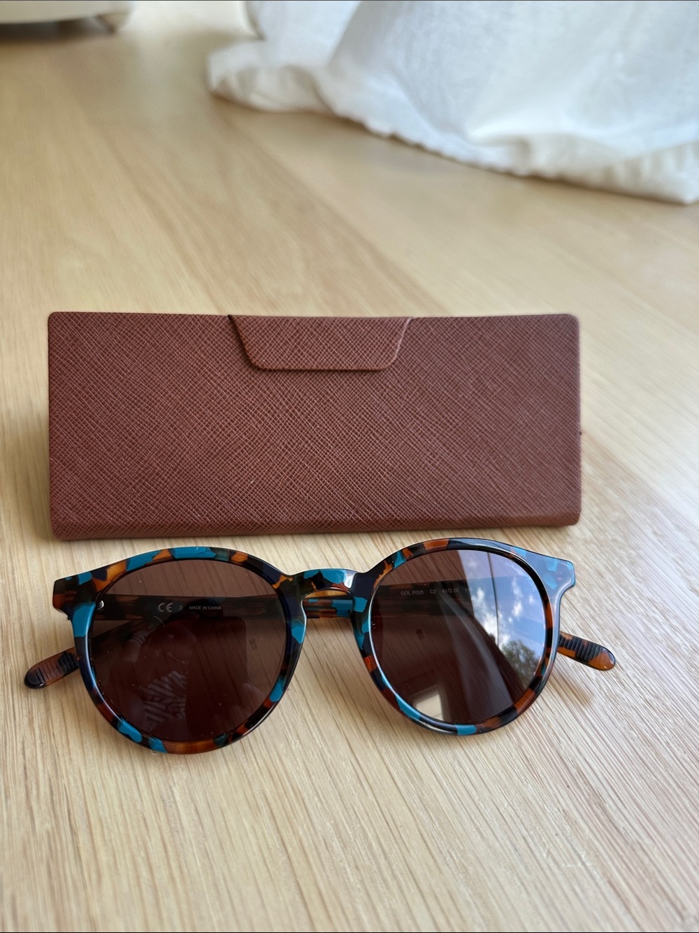 Women’s Round Tortoiseshell Sunglasses with Blue Accents